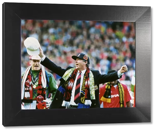 Manchester United manager Alex Ferguson celebrates as his team are crowned champions at