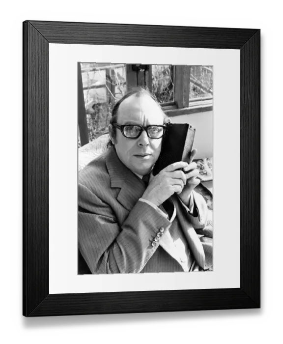 Framed Print : Eric Morecambe, Comedian & Luton FC Director, listens to match report on the radio