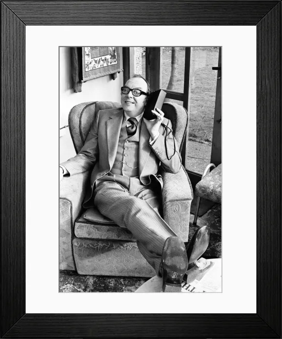 Framed Print : Eric Morecambe, Comedian & Luton FC Director, listens to match report on the radio Framed Print : Eric Morecambe, Comedian & Luton FC Director, listens to match report on the radio