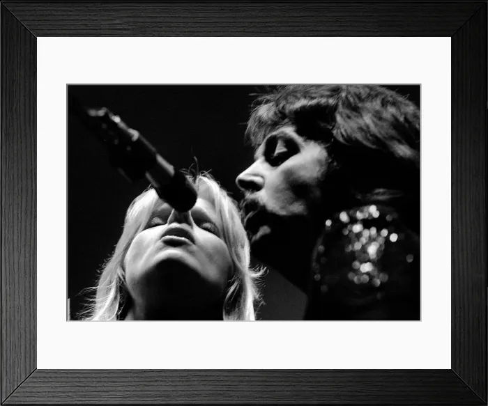 Framed Print : Paul McCartney, formerly of The Beatles, singing with his wife Linda as part of their Framed Print : Paul McCartney, formerly of The Beatles, singing with his wife Linda as part of their
