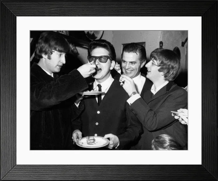 Framed Print : Roy Orbison being fed birthday cake by John Lennon while Ringo Starr looks Framed Print : Roy Orbison being fed birthday cake by John Lennon while Ringo Starr looks