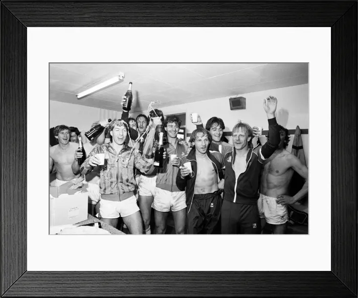 Framed Print : Birmingham City players celebrate with champagne in the dressing room after they clinched Framed Print : Birmingham City players celebrate with champagne in the dressing room after they clinched