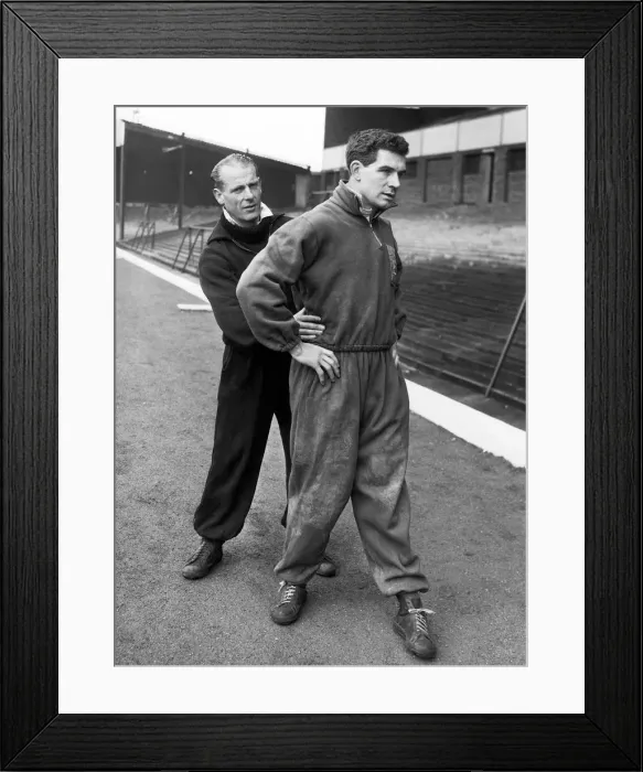 Framed Print : Birmingham City footballer Eddie Brown receives attention from assistant trainer Doug Framed Print : Birmingham City footballer Eddie Brown receives attention from assistant trainer Doug