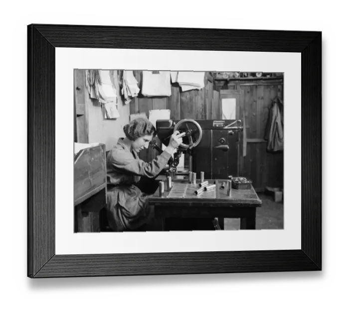 Framed Print : A women examines the bolts used in the construction of the Miles 3 Falcon aircraft Framed Print : A women examines the bolts used in the construction of the Miles 3 Falcon aircraft