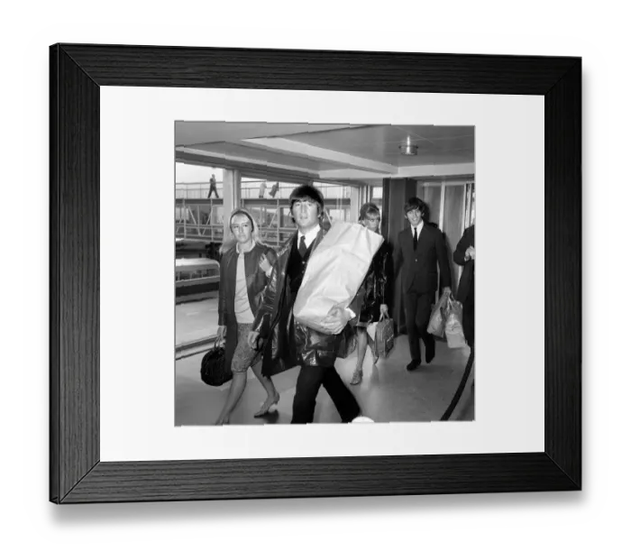 Framed Print : John Lennon and his wife Cynthia arrive back at London Airport from their holidays Framed Print : John Lennon and his wife Cynthia arrive back at London Airport from their holidays