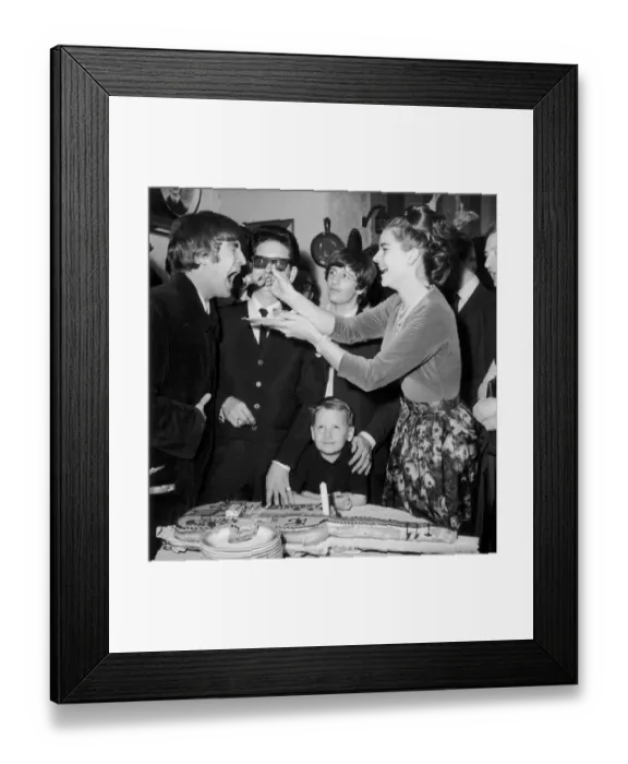 Framed Print : John Lennon being fed birthday cake by Claudette Orbison while her husband Roy Framed Print : John Lennon being fed birthday cake by Claudette Orbison while her husband Roy