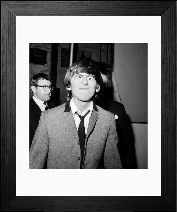 Framed Print : George Harrison with glass eyes when the Beatles details were being taken for their Framed Print : George Harrison with glass eyes when the Beatles details were being taken for their