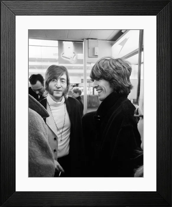 Framed Print : Beatles John Lennon and George Harrison at Heathrow Airport before departing to India Framed Print : Beatles John Lennon and George Harrison at Heathrow Airport before departing to India