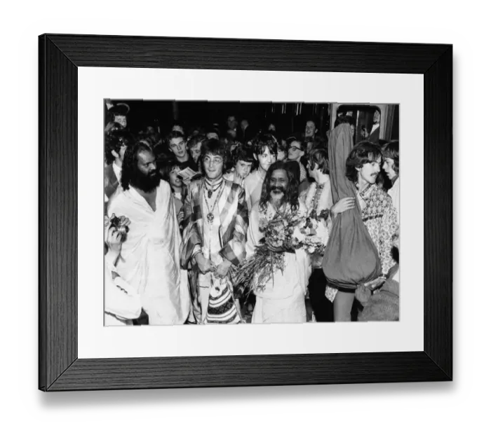 Framed Print : The Beatles with the Maharishi Mahesh Yogi who is clutching bundles of flowers Beatles