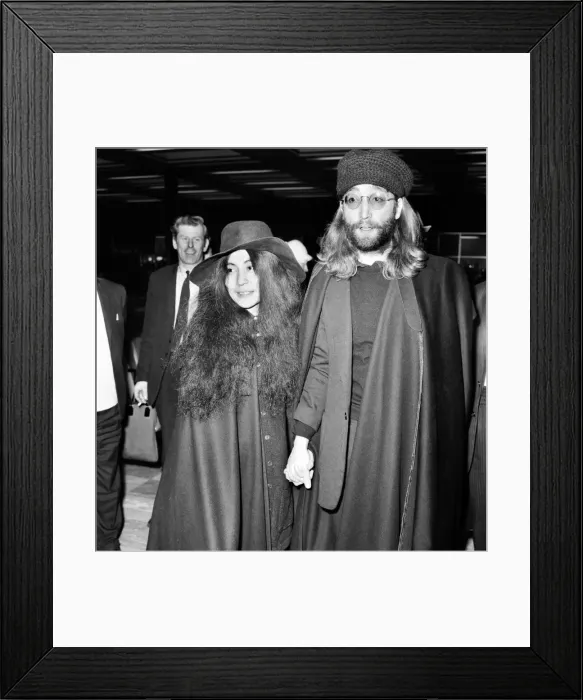 Framed Print : John Lennon and Yoko Ono dressed all in black, pictured at Heathrow today as they leave Framed Print : John Lennon and Yoko Ono dressed all in black, pictured at Heathrow today as they leave