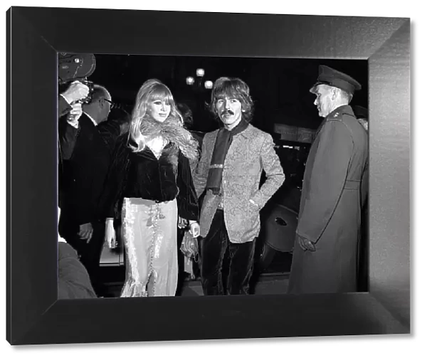 George Harrison and wife Patti Boyd arriving at the film premiere of '