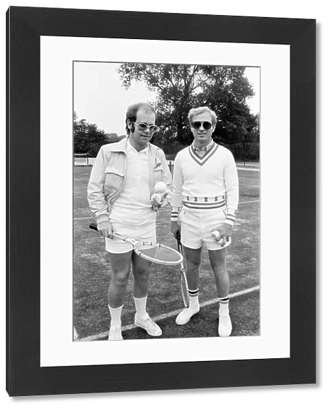 Elton John with Larry King (husband of Billie-Jean King) at Wimbledon playing tennis