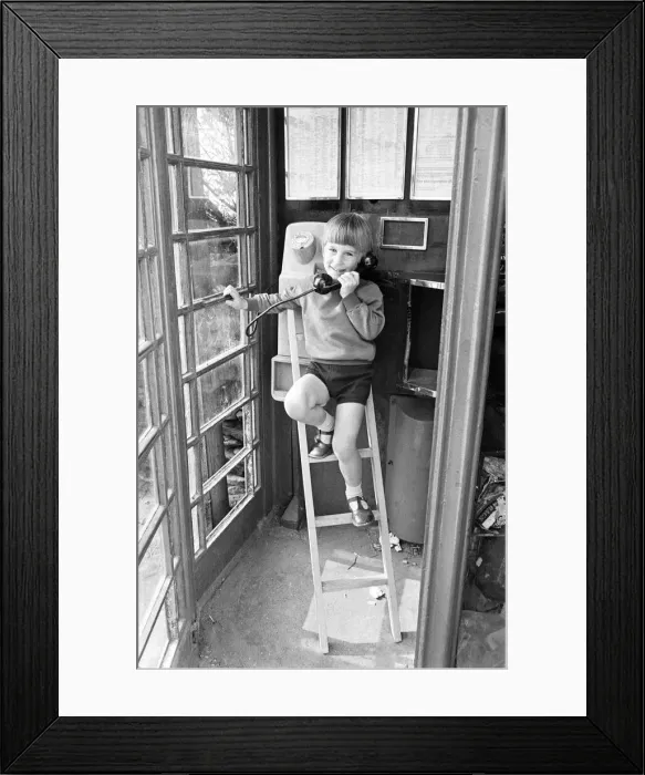 Framed Print : Five year old Andrew Butler, complete with a mini-stepladder, phones his girlfriend Framed Print : Five year old Andrew Butler, complete with a mini-stepladder, phones his girlfriend
