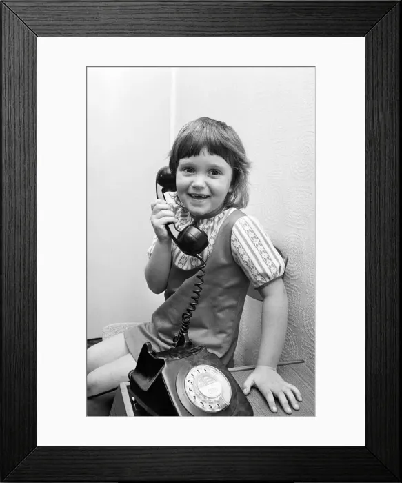Framed Print : Six year old Jayne Myers receives her weekly phone call from Five year old boyfriend Framed Print : Six year old Jayne Myers receives her weekly phone call from Five year old boyfriend