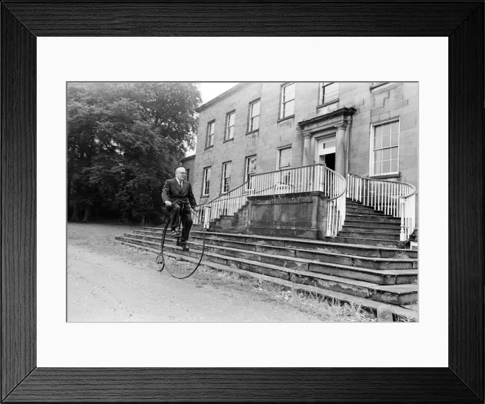Framed Print : Mr Philip Yorke takes a trip around the grounds of his house on a Penny Farthing