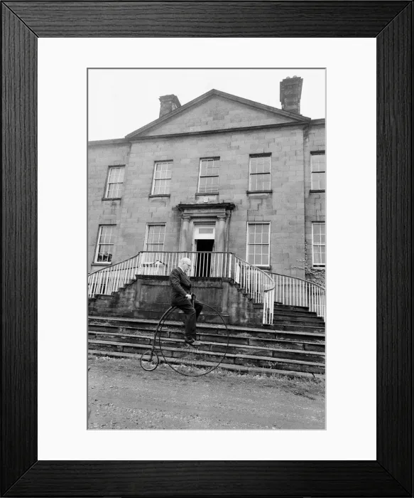 Framed Print : Mr Philip Yorke takes a trip around the grounds of his house on a Penny Farthing