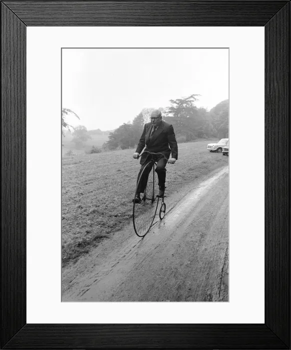 Framed Print : Mr Philip Yorke takes a trip around the grounds of his house on a Penny Farthing