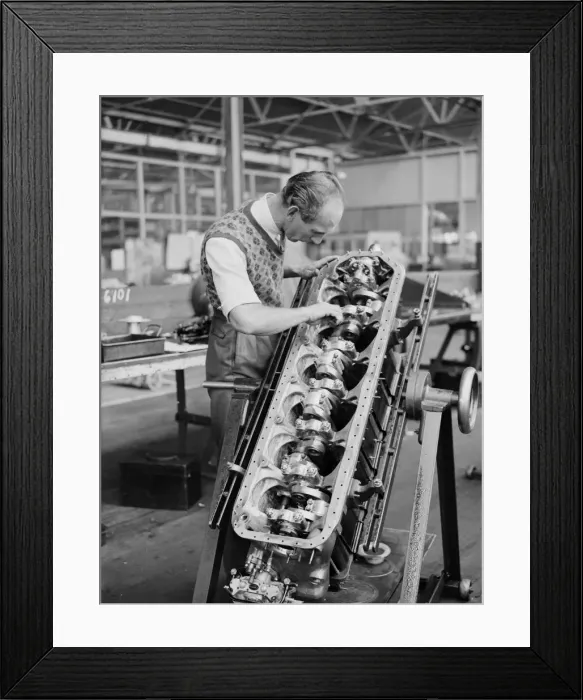 Framed Print : An engineer checks the pistons of the Gipsy Six engine during the construction of Framed Print : An engineer checks the pistons of the Gipsy Six engine during the construction of