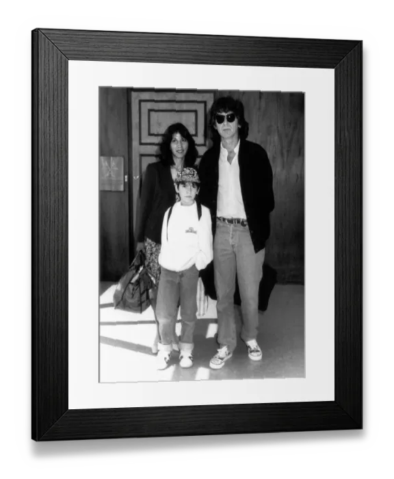 Framed Print : George Harrison formerly of the Beatles with family at London Airport August 1989