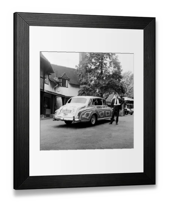 Framed Print : The chauffeur of The Beatles singer John Lennon standing beside Lennon