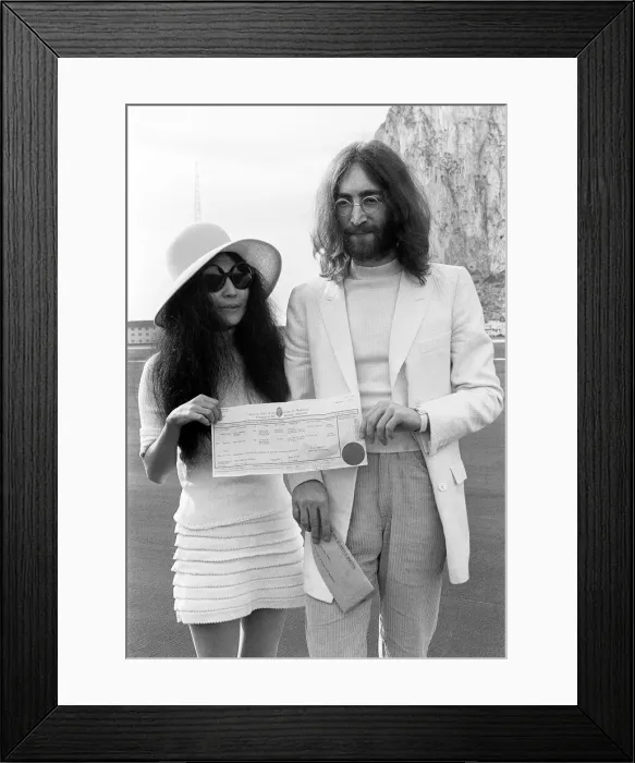 Framed Print : Beatles singer John Lennon and his new bride Yoko Ono holding their marriage certificate Framed Print : Beatles singer John Lennon and his new bride Yoko Ono holding their marriage certificate