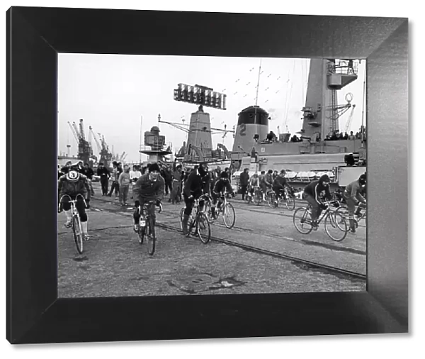 Ratings from HMS Jupiter seen here taking part in a cycle race started from the bridge of