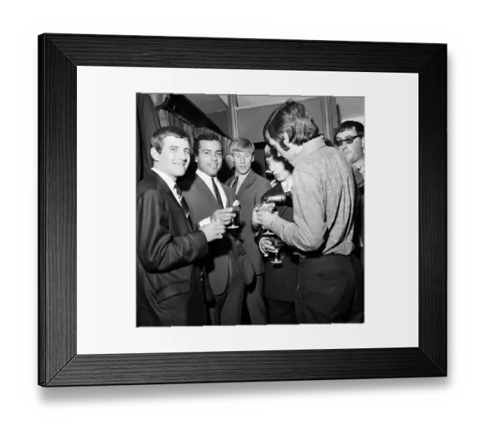 Framed Print : Manchester United footballer George Best celebrates the opening of his fashion boutique