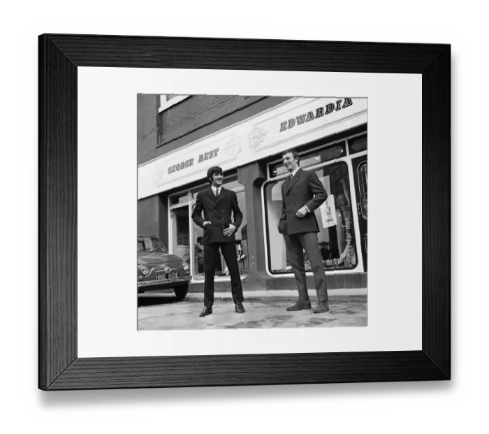Framed Print : Manchester United footballer George Best celebrates the opening of his fashion boutique