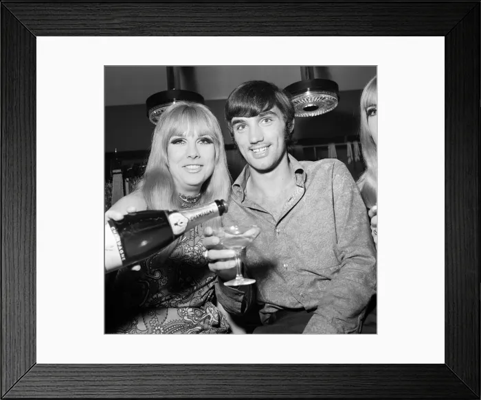 Framed Print : Manchester United footballer George Best celebrates the opening of his fashion boutique Framed Print : Manchester United footballer George Best celebrates the opening of his fashion boutique