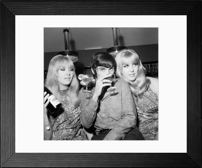 Framed Print : Manchester United footballer George Best celebrates the opening of his fashion boutique Framed Print : Manchester United footballer George Best celebrates the opening of his fashion boutique