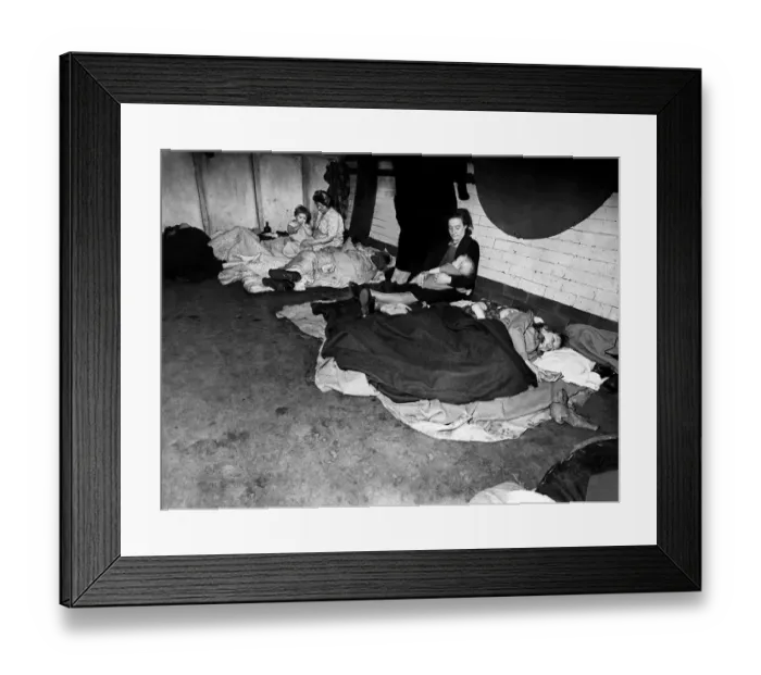 Framed Print : Woman feeding her baby in an underground tube station used as an air raid shelter during