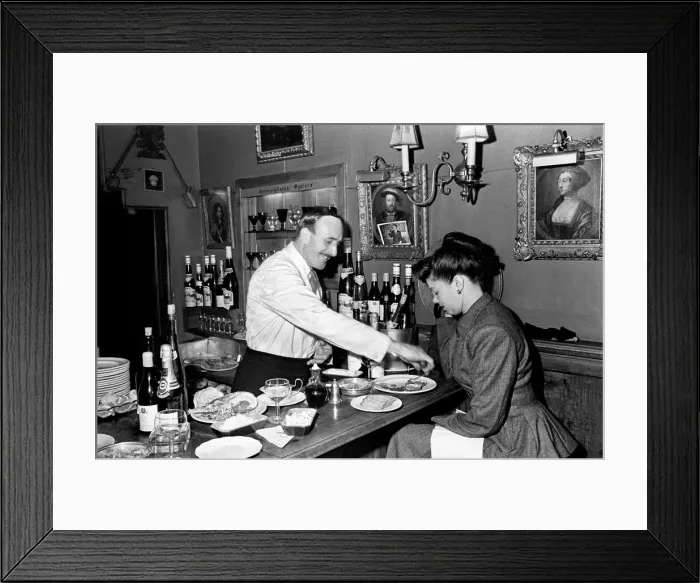 Framed Print : A woman dining at a restaurant in Shepherds Bush. 1st July 1948