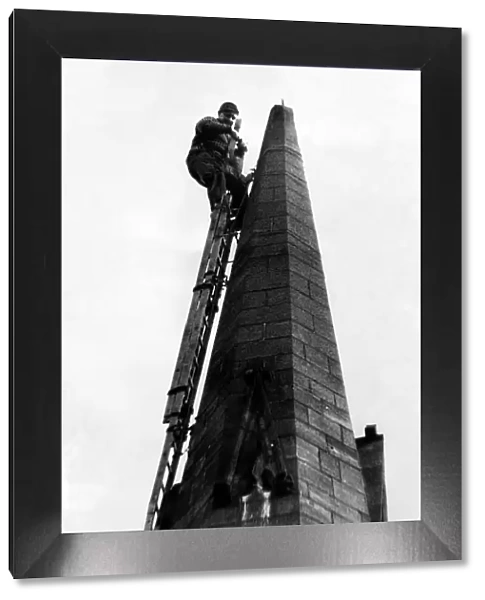 A steeplejack repairing a chuch spire on 2nd May 1968