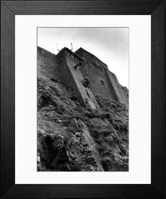 Framed Print : Steeplejack David Stone at work on Lindisfarne Castle on 10th November 1988