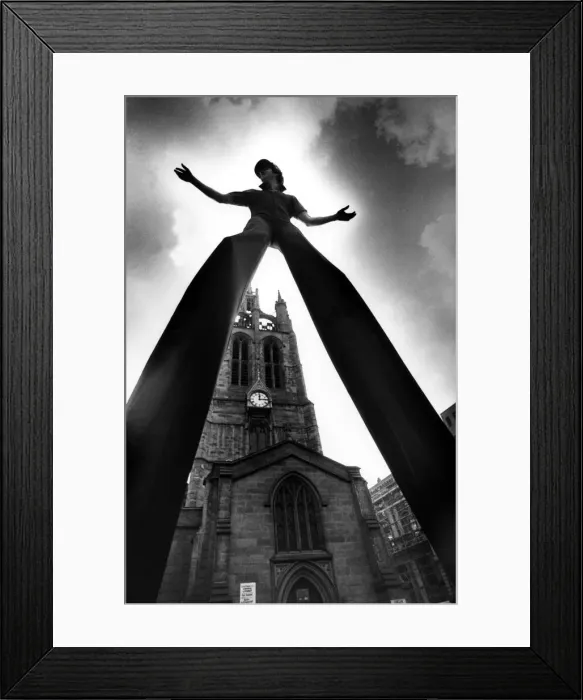 Framed Print : Walking Tall! World champion stilt walker John Long set some heads turning when he went Framed Print : Walking Tall! World champion stilt walker John Long set some heads turning when he went