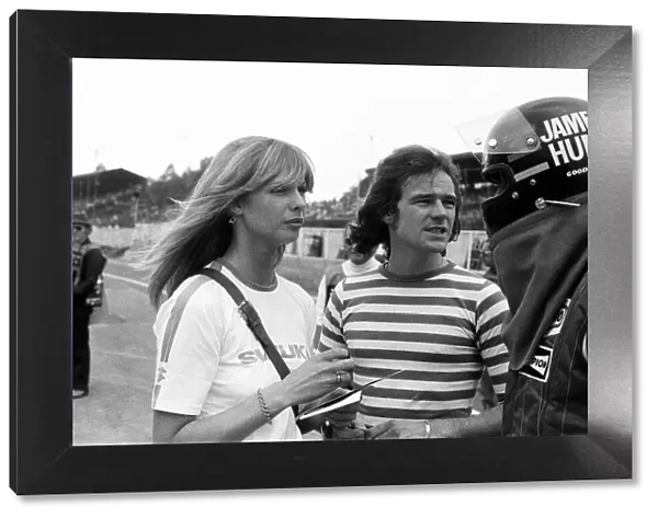 Barry Sheene and his girlfriend Stephanie McLean talking to James Hunt at a practice day
