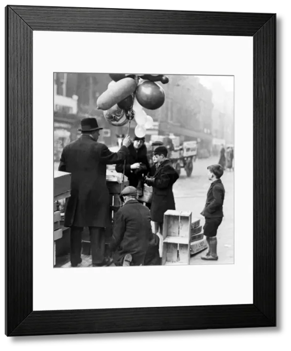 Framed Print : The balloon man was doing a roaring trade in the centre of Newcastle on 21st December Framed Print : The balloon man was doing a roaring trade in the centre of Newcastle on 21st December
