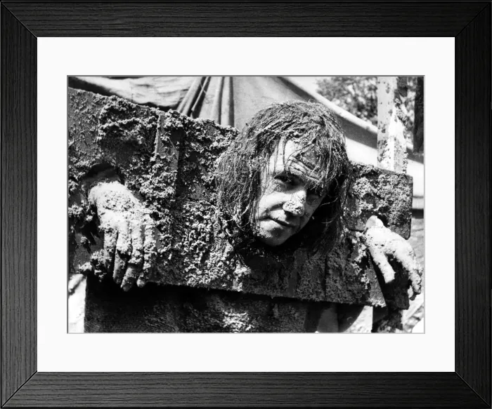 Framed Print : Standing in the stocks and getting facefuls of sand pies is Brian Lowes of Sedgefield Framed Print : Standing in the stocks and getting facefuls of sand pies is Brian Lowes of Sedgefield