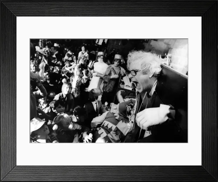 Framed Print : A man is some medieval stocks waiting to be hit by eggs on 11th December 1973 Framed Print : A man is some medieval stocks waiting to be hit by eggs on 11th December 1973