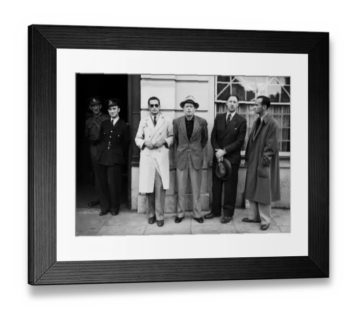 Framed Print : One of the BOAC flying boat crew poses with passengers at Poole police station where