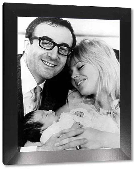 Peter Sellers and his wife Britt Ekland pictured with their first baby, Victoria