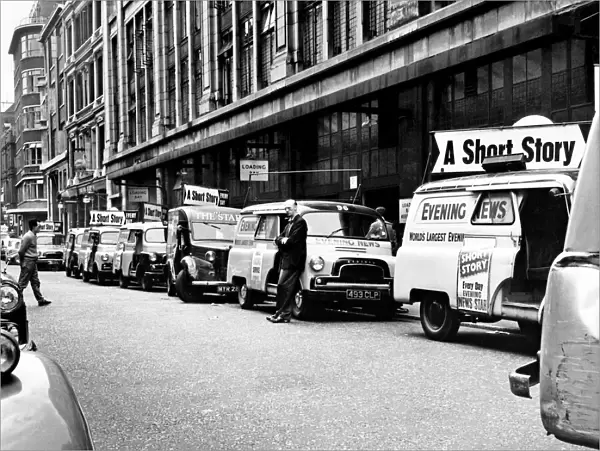 Newspaper printing. Delivery vans of the London evening News wait for the paper to roll