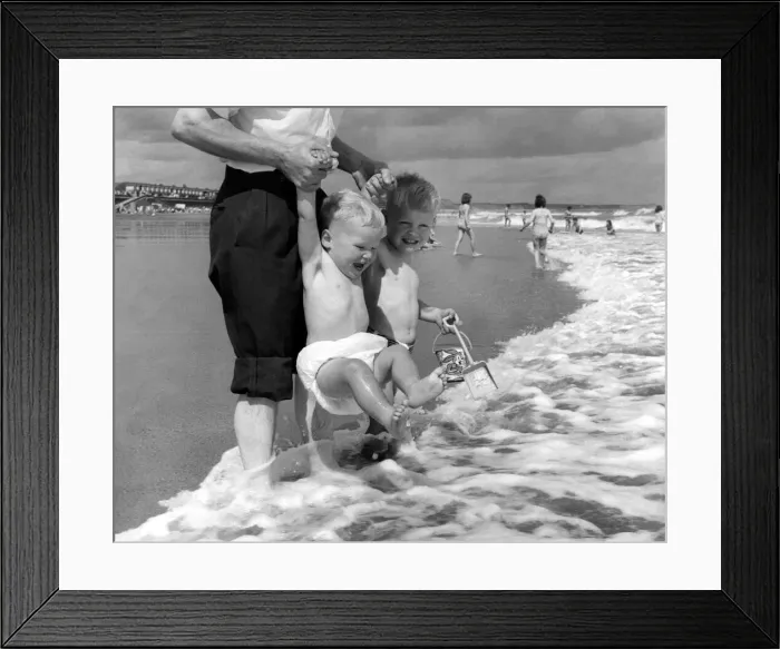 Framed Print : Summer Weather Scenes - Sunbathing Two young children enjoy splashing around in Framed Print : Summer Weather Scenes - Sunbathing Two young children enjoy splashing around in