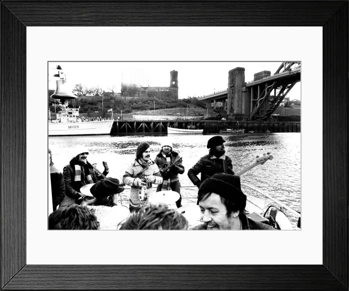 Framed Print : Lindisfarne sailed down the Tyne on a musical journey. The group were filming on board a Framed Print : Lindisfarne sailed down the Tyne on a musical journey. The group were filming on board a