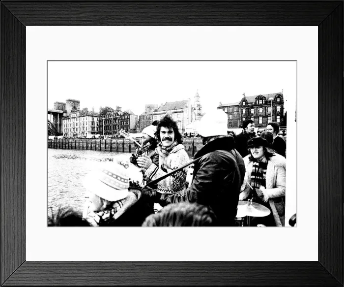 Framed Print : Lindisfarne sailed down the Tyne on a musical journey. The group were filming on board a Framed Print : Lindisfarne sailed down the Tyne on a musical journey. The group were filming on board a