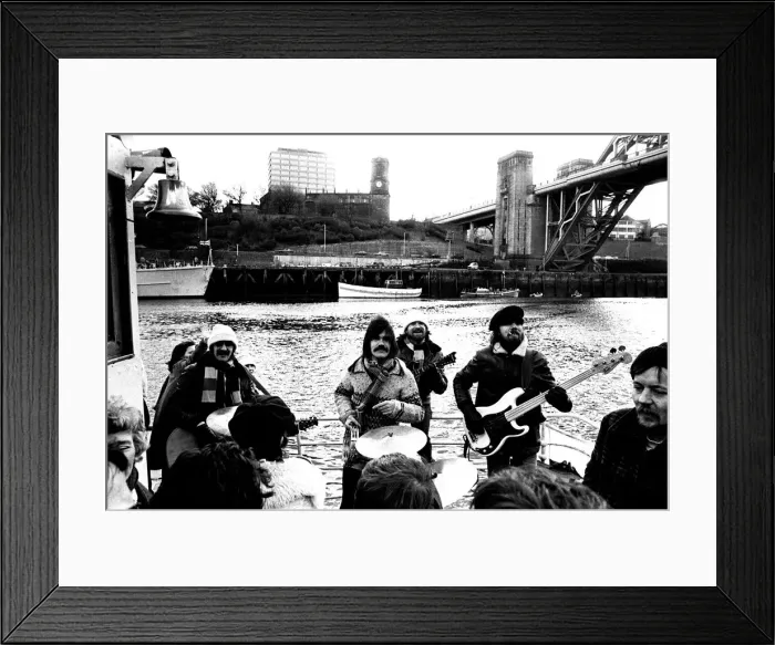 Framed Print : Lindisfarne sailed down the Tyne on a musical journey. The group were filming on board a Framed Print : Lindisfarne sailed down the Tyne on a musical journey. The group were filming on board a