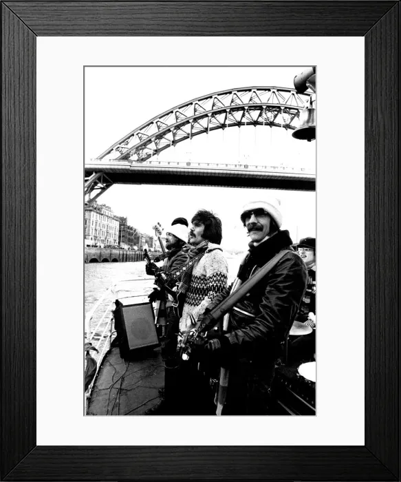 Framed Print : Lindisfarne sailed down the Tyne on a musical journey. The group were filming on board a Framed Print : Lindisfarne sailed down the Tyne on a musical journey. The group were filming on board a