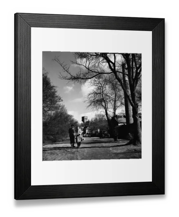 Framed Print : Two men walking through the park in St. Albans with the cathedral in the background