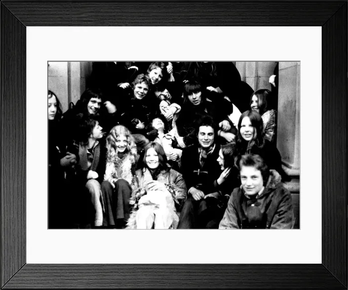 Framed Print : These teenage David Bowie fans queue in pouring rain for tickets for his concert
