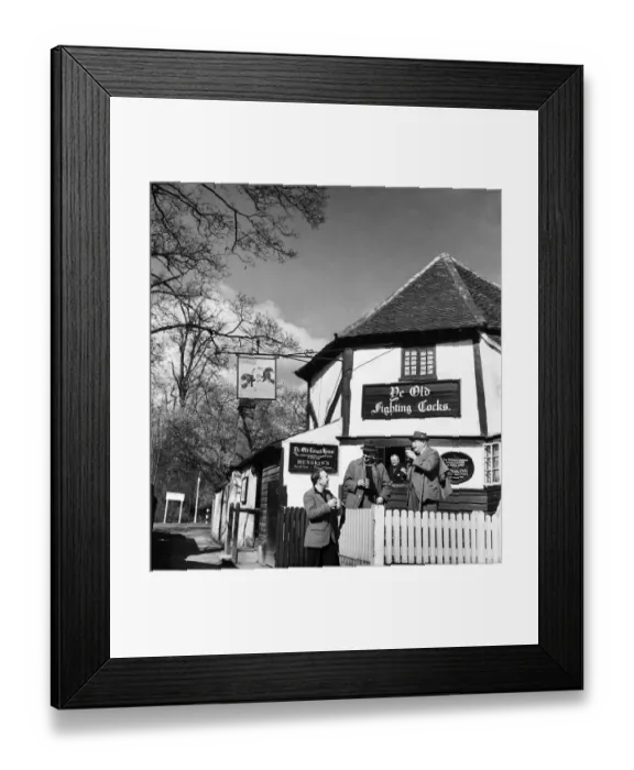 Framed Print : Men drinking at their local pub Ye Olde Fighting Cocks in St. Albans